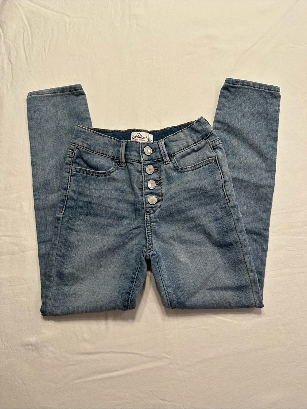 Button-Fly High-Rise Skinny Jeans in Light Blue